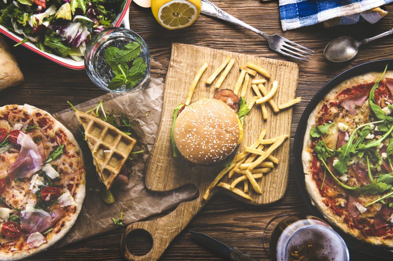 Top view of an assortment of food on wood table
