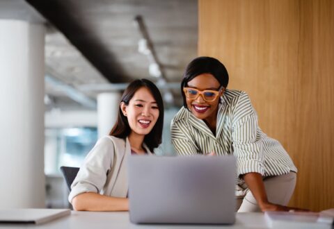 Two professional women discussing PR for edtech companies