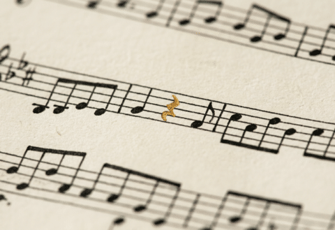 Black and white sheet muuic with one gold note