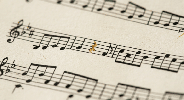 Black and white sheet muuic with one gold note